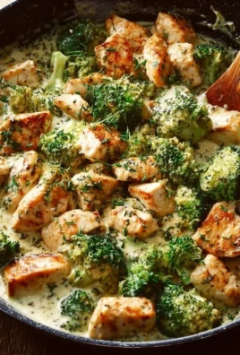 Delicious creamy chicken and broccoli skillet dish ready to serve in a pan