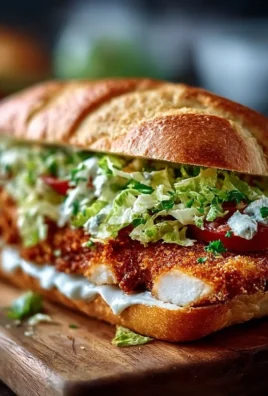 Crispy chicken Caesar sandwich with fresh romaine and creamy dressing