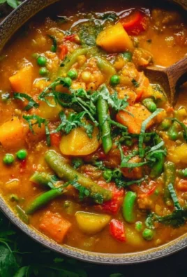 A vibrant bowl of easy vegetable curry with fresh vegetables and spices