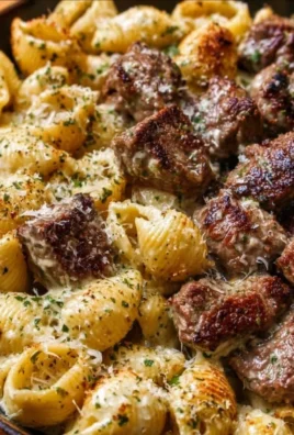 Delicious garlic butter steak bites served with creamy parmesan shells