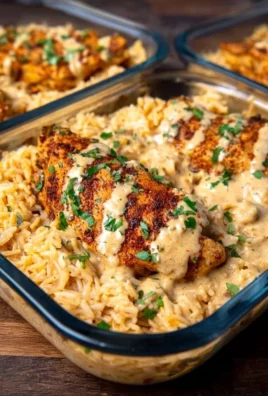 High protein creamy Cajun chicken served with rice in a delicious dish
