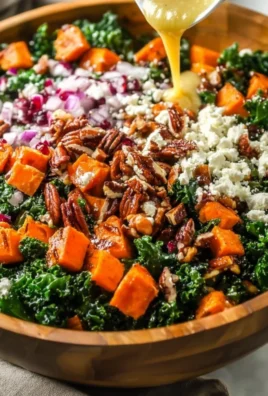 Roasted sweet potato kale salad with colorful ingredients in a bowl