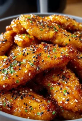 Air fryer honey butter garlic chicken tenders served with dipping sauce