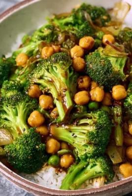 Bowl of broccoli stir fry with chickpeas and vibrant vegetables