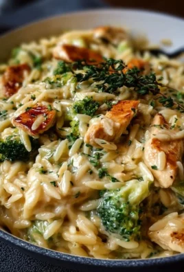 Delicious cheesy chicken broccoli orzo served in a bowl