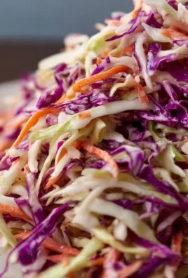 Bowl of fresh coleslaw with colorful cabbage and carrots