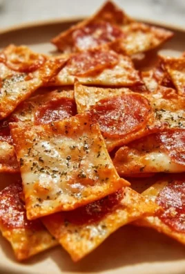 A bowl of crispy pizza chips, a delicious snack option for pizza lovers.