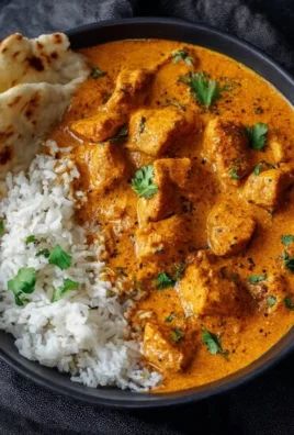 Delicious chicken korma served with flatbread and rice, homemade recipe.