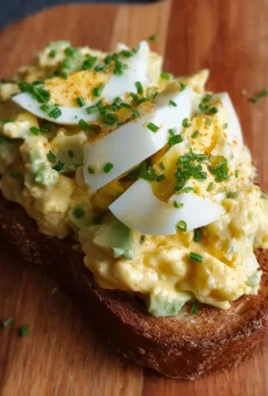 Delicious egg salad with avocado served in a bowl