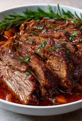 Delicious Italian Pot Roast (Stracotto) served with herbs and vegetables