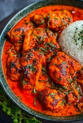 Nigerian chicken stew served in a bowl with vibrant vegetables and spices