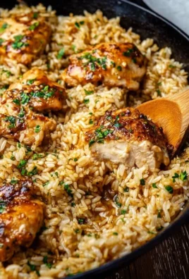 One-Pot Garlic Butter Chicken with Rice served in a skillet