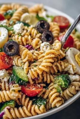 Simple high protein pasta salad with fresh vegetables and dressing