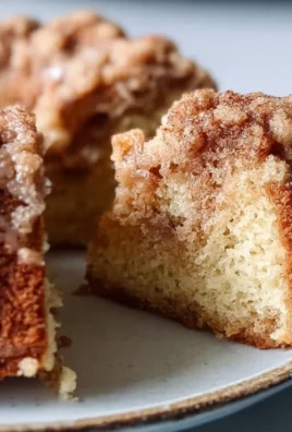 Homemade sourdough discard coffee cake topped with cinnamon and nuts