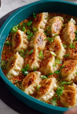 Delicious viral dumpling bake topped with sauce and herbs